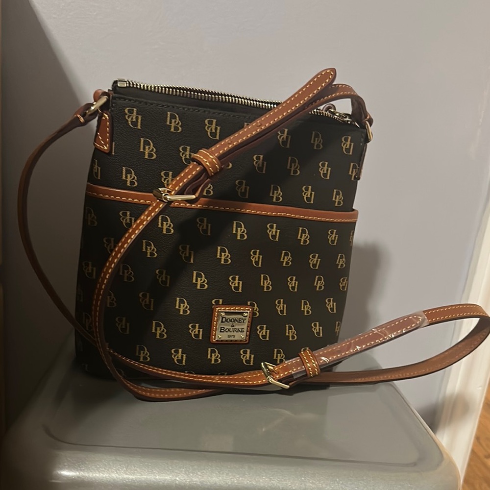 Dooney & Bourke Black and Tan Logo Crossbody, 9” wide, 8” high, inside zipper